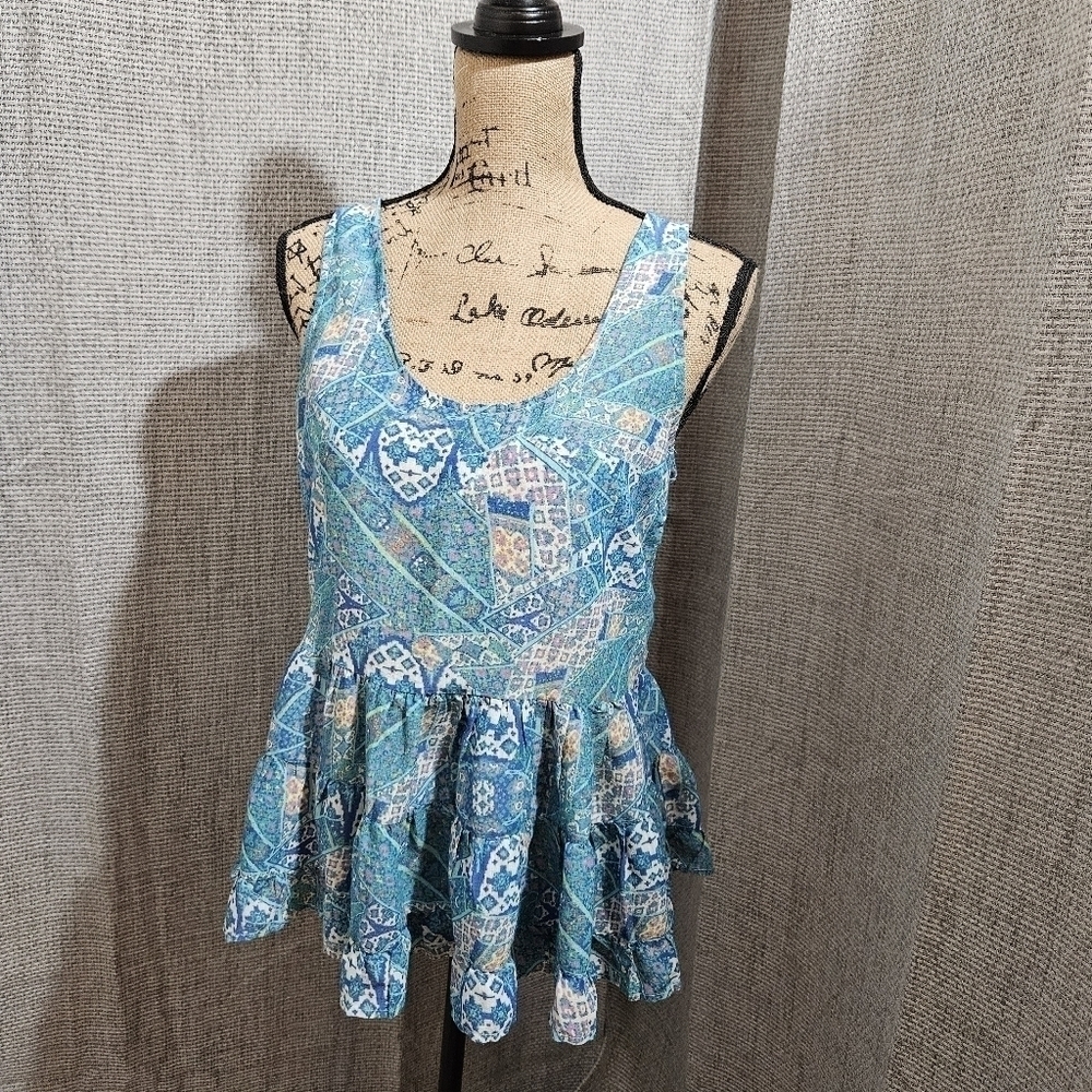 Multi-Patterned Sleeveless Top with Layered Peplum Bottom Size M